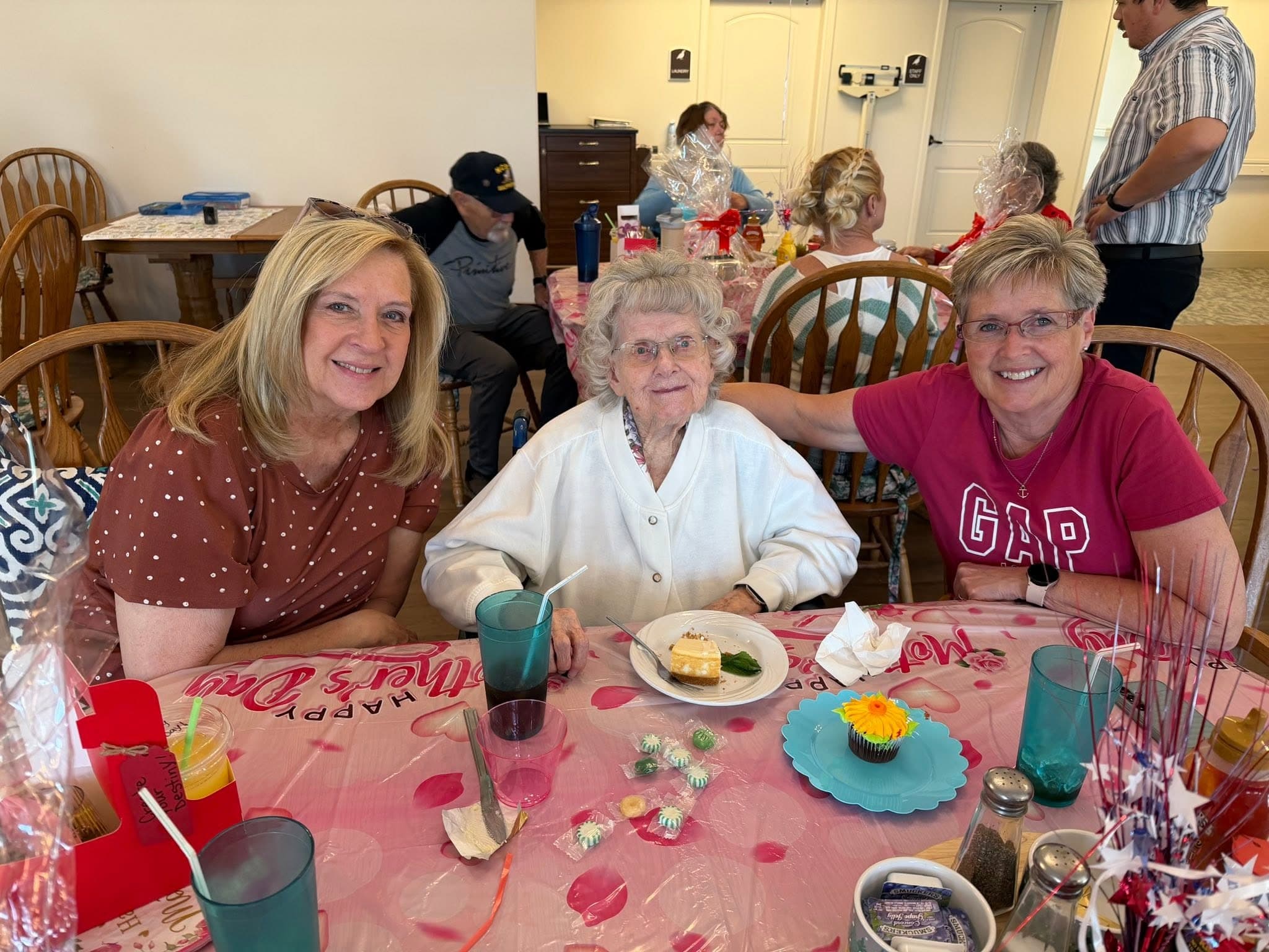 Residents and family celebrating together at a Mother's Day dining event