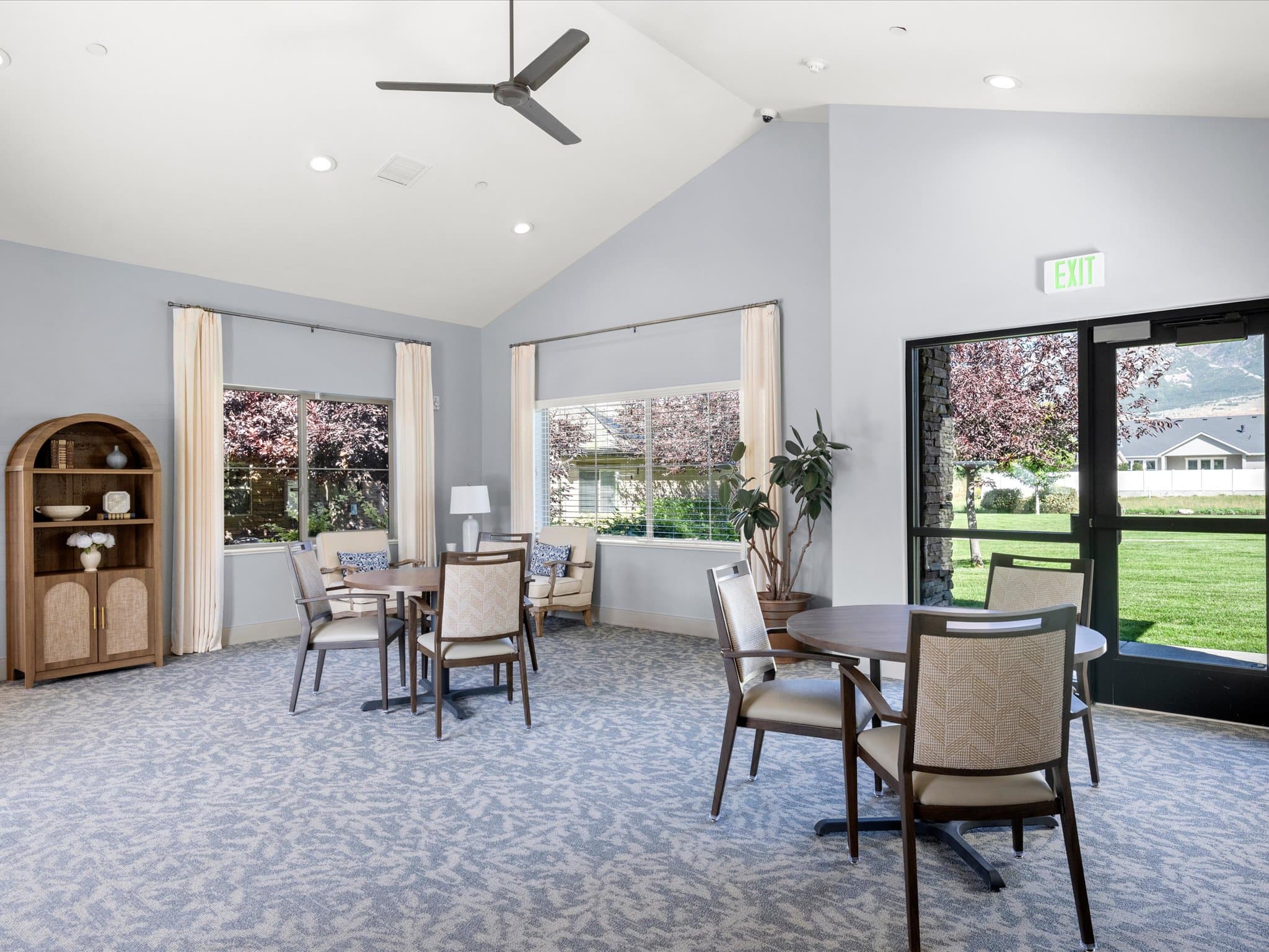Activity room with card tables and garden views