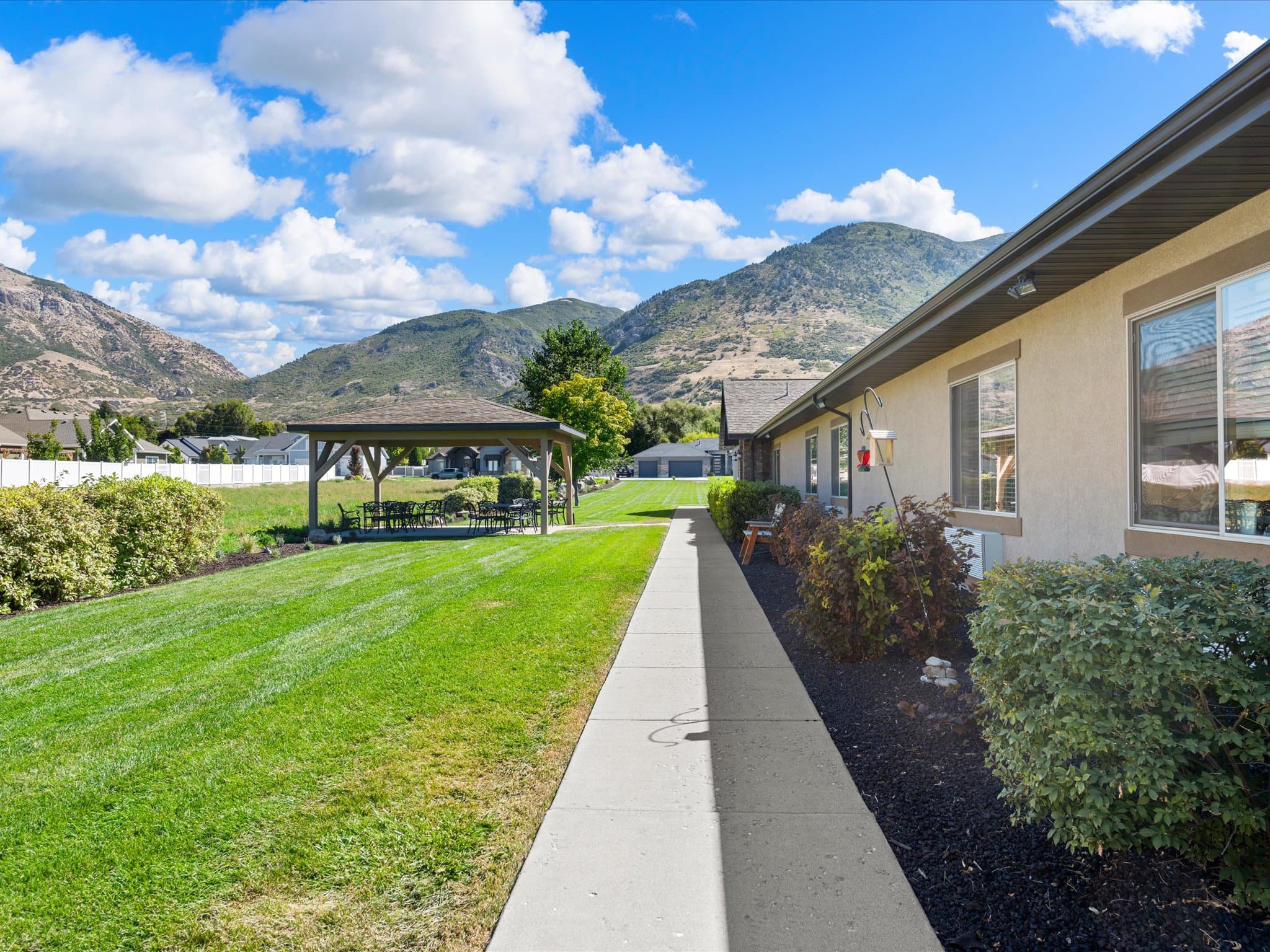 Covered walkway along the building with mountain views