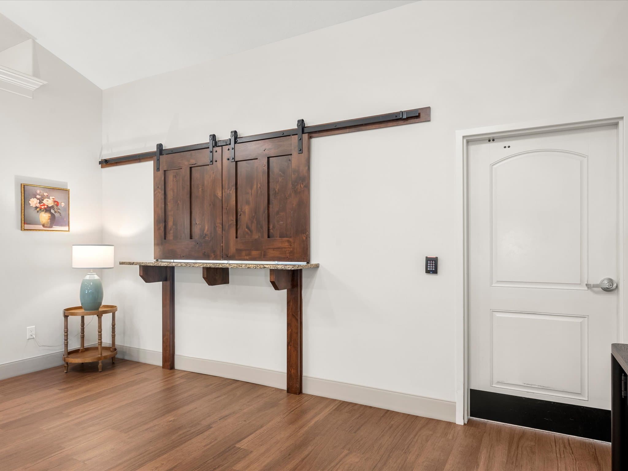 Sliding barn-door media console in the memory care common room