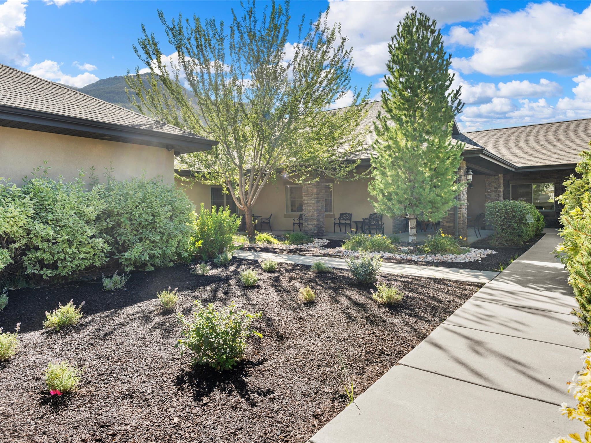 Landscaped walkway along the memory care courtyard