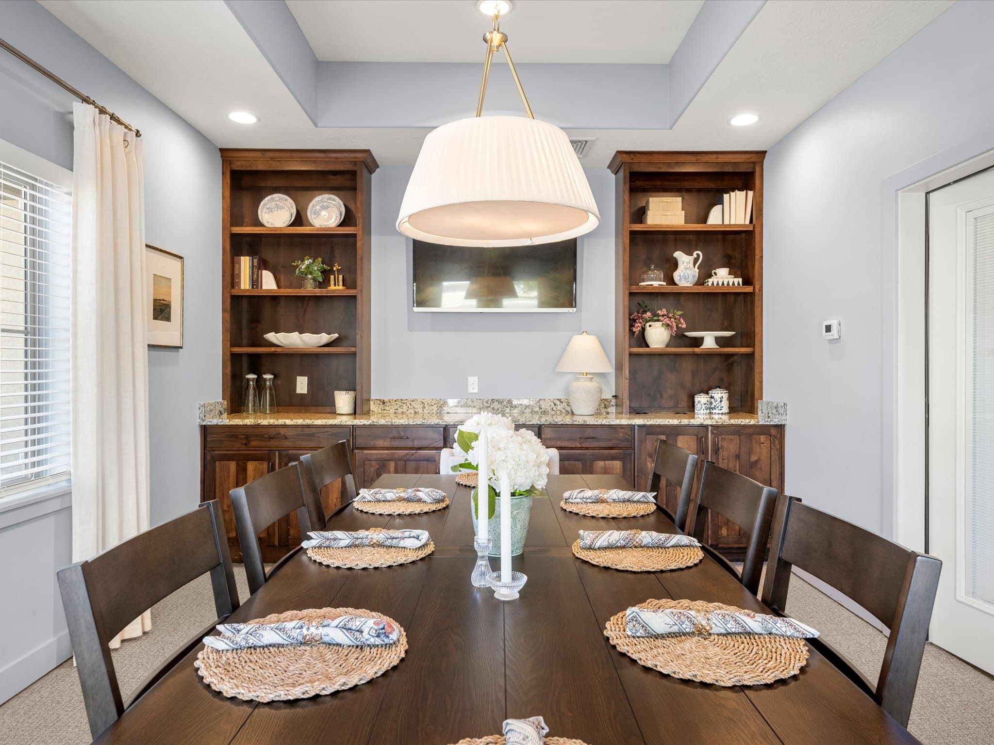 Private dining room with built-in shelving set for a family gathering