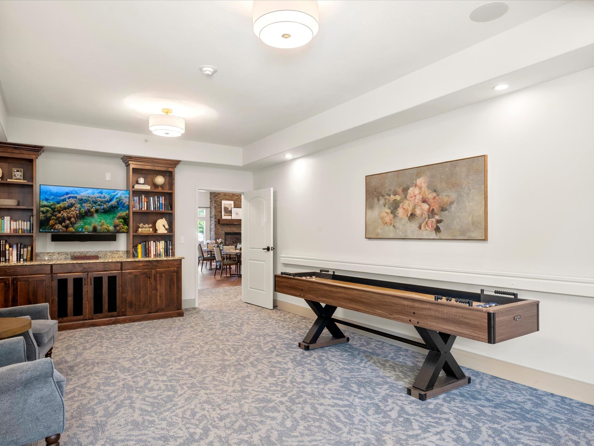 Game room with a shuffleboard table